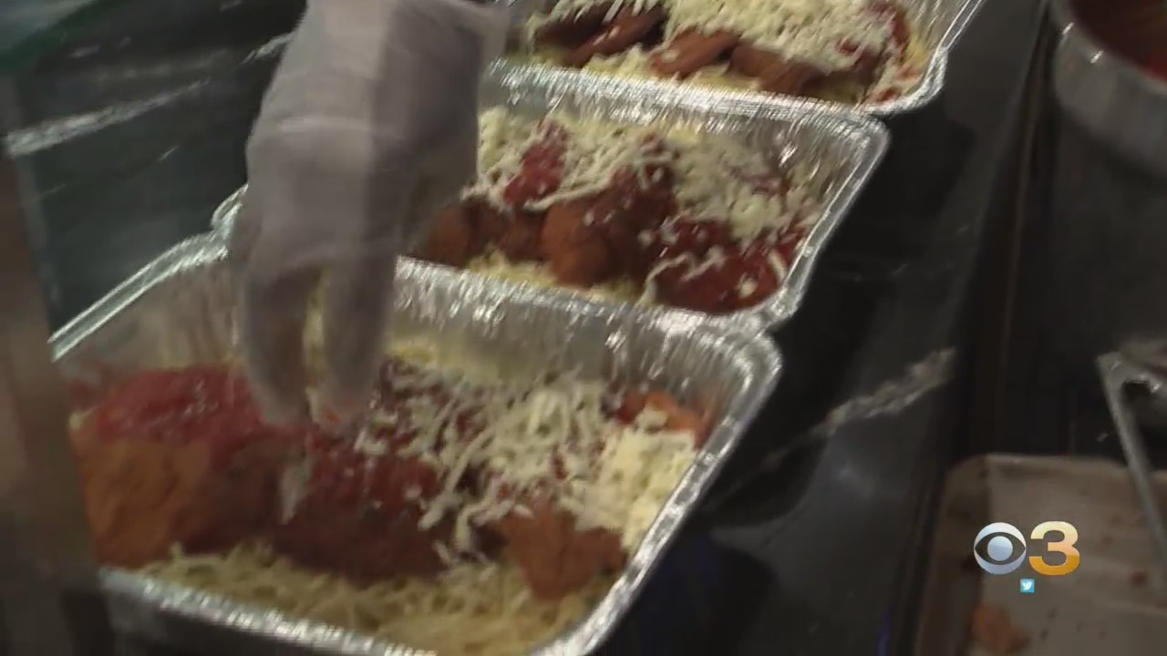 Image of hand making Italian dinner